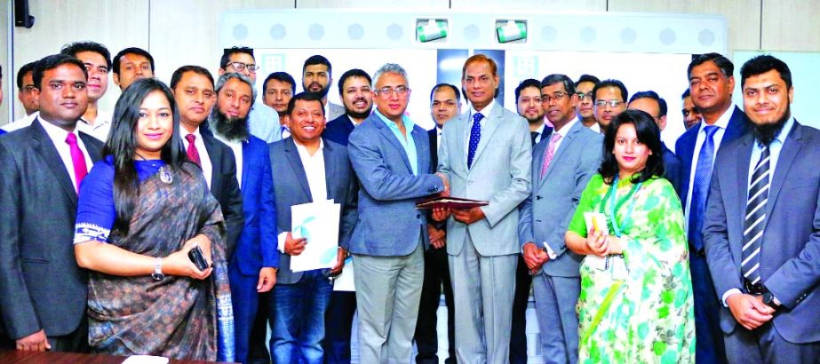 Md. Sazzad Hossain, DMD of Bank Asia Limited and Yasir Azman, Deputy CEO of Grameenphone Limited, exchanging a MoU on Digital Financial Inclusion and e-commerce at GP House in the city on Tuesday. Md Arfan Ali, Managing Director of the bank and AKM Al-Ami