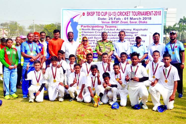 Members of Chittagong Ispahani Cricket Acdemy, the champions of the BKSP TID Cup Under-13 Cricket Tournament with the chief guest Director General of BKSP Brigadier General Md Shamsur Rahman and the other officials of BKSP pose with the trophy at BKSP in