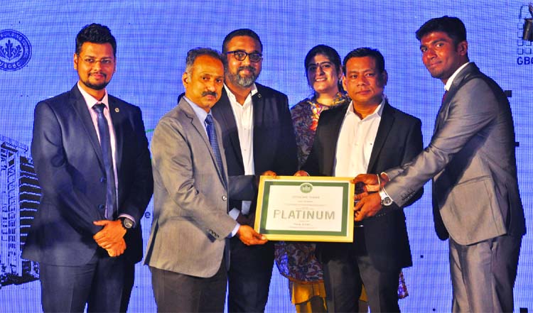 Managing Director of Pacific and Middle East Zone of Green Business Certification Incorporate Gopala Krishnan handing over First Leed Platinum Certificate to the Managing Director of Cityscape International Limited Nahid Sarwar at the Cityscape Tower in t