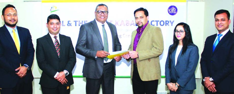 M. Khorshed Anowar, Head of Business of Retail Banking of Eastern Bank Limited and Md. Mahtabul Amin, CEO of SR Group, exchanging an agreement signing documents at its office in the city recently. Under the deal, cardholders of the bank will enjoy 15 perc