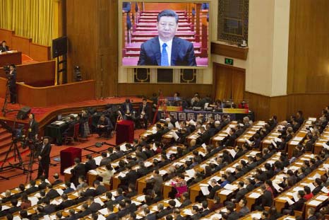 Chinese President Xi Jinping is seen on a large screen at the opening session of the Chinese People's Political Consultative Conference in Beijing's Great Hall of the People.