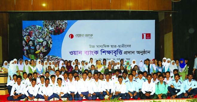 Sayeed H. Chowdhury, Chairman of ONE Bank Limited, poses with the scholarship recipients of various educational institutions of Rajshahi, Sirajgonj, Rangpur and Bogra District at Shahid Titu Auditorium in Bogra on Sunday. M Fakhrul Alam, Managing Director