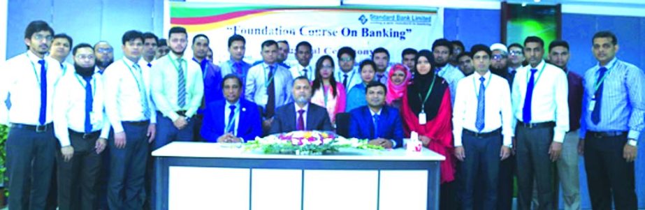 Mamun-Ur-Rashid, Managing Director of Standard Bank Limited, presiding over its four week- long training on "Foundation Course on Banking" for Officer and Senior Officer at its Training Institute in the city recently. Md. Zakaria, Principal and Md. Amza