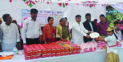 MAN IKGANJ: Mohammad Ali Akbar, Chairman, Shibalaya Upazila distributing prizes among the winners of the 18th annual sports competition of Shikshaniloy Pre- Cadet School as Chief Guest on Saturday.