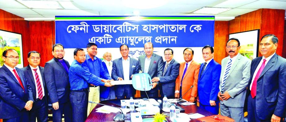 A.K.M. Shaheed Reza, Chairman, Mercantile Bank Limited handed over a Key of ambulance to Sushil Chandra Shil, Secretary of Feni Diabetic Samity at Bank's head office on Wednesday. Kazi Masihur Rahman, Managing Director and Md. Quamrul Islam Chowdhury, AM