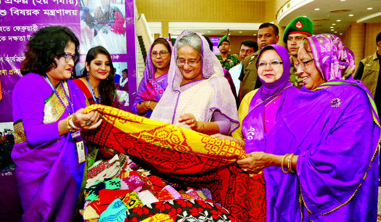 Prime Minister Sheikh Hasina visited different stalls installed by women at the Bangabandhu International Conference Center in the city on Thursday marking International Women's Day. PMO photo
