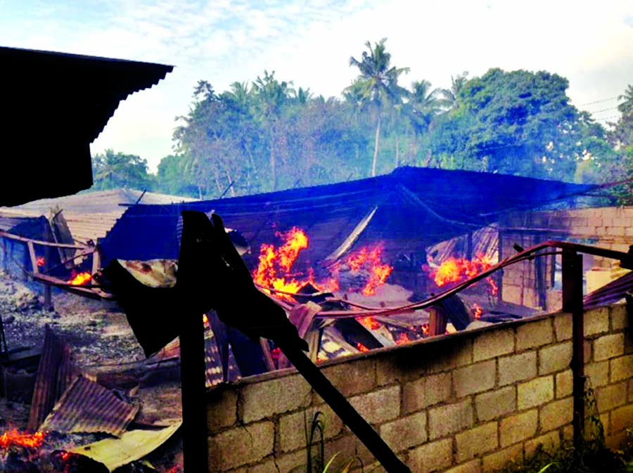 A timber depot burns in Mullegama village in Kandy, Sri Lanka on Wednesday.