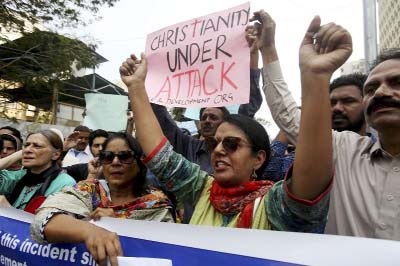 Pakistani civil society activists protest in favor of the Christian community in Karachi, Pakistan.