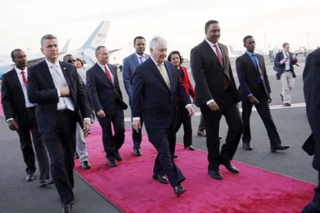 US Secretary of State Rex Tillerson, (center) walks with Ethiopia Minister of Foreign Affairs Workneh Gebeyehu, (center right), as he arrives to begin a six-day trip in Africa, after landing at Addis Ababa International Airport on Wednesday.