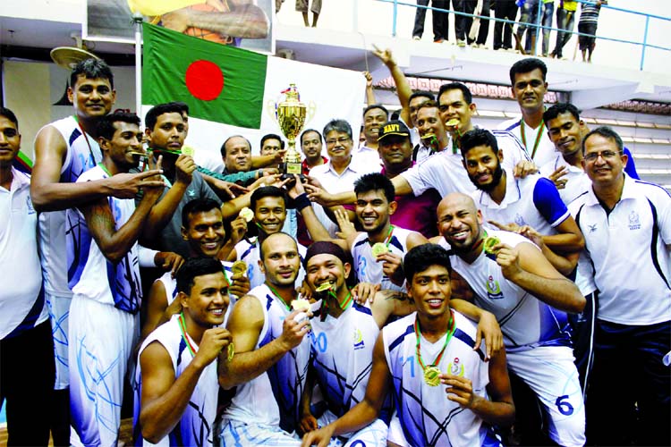 Members of Bangladesh Navy team, the champions of the Independence Day Basketball Tournament with the guests and officials of Bangladesh Basketball Federation pose for photograph at Dhanmondi Basketball Gymnasium in the city on Friday.