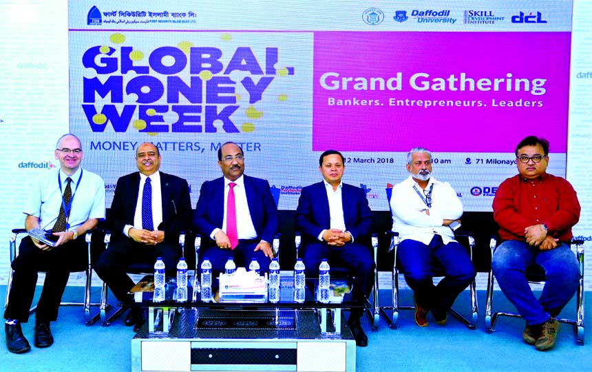 SK Sur Chowdhury, Adviser of Bangladesh Bank, inaugurating "Global Money Week 2018" at Daffodil International University on Monday. Syed Waseque Md Ali, Managing Director of First Security Islami Bank Limited, Sebastian Pearce, Director (Exam) of Britis