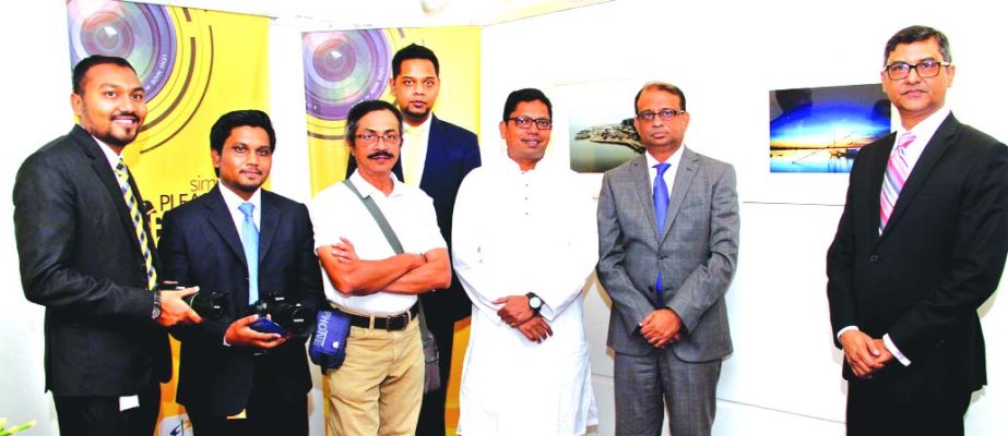 Zunaid Ahmed Palak, State Minister for ICT Division, Ali Reza Iftekhar, MD and CEO, Ziaul Karim, Head of Brand and Communications of EBL along with the winners of EBL Employee's Photo Contest at the opening ceremony of 3-day photo exhibition, organised b