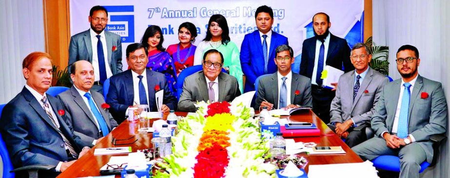 A Rouf Chowdhury, Chairman of Bank Asia Securities Ltd, signing the audited financial statement of the company for the year ended 31st December 2017 at its 7th AGM at the company's head office on Tuesday.