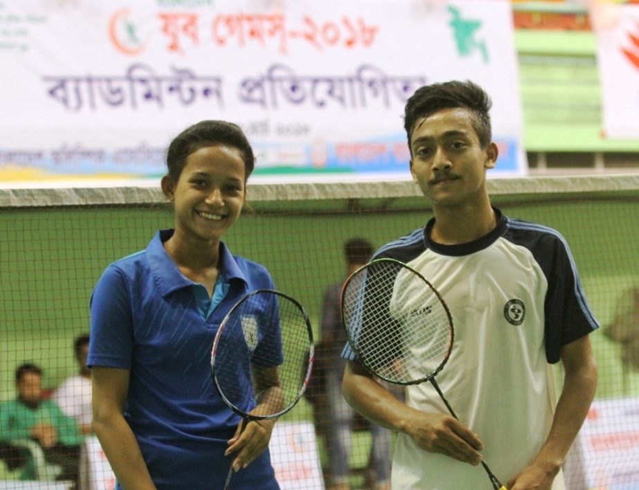 Single champions in badminton Urmy and Sirgatullah of Chittagong pose for photo on Tuesday.