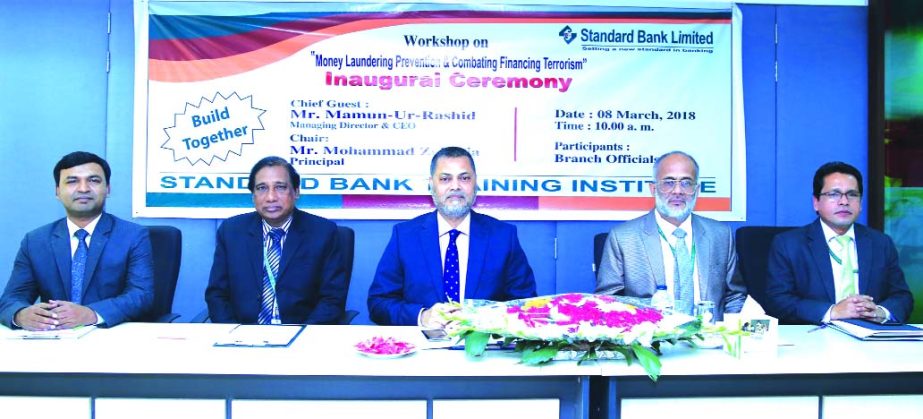 Mamun-Ur-Rashid, Managing Director of Standard Bank Limited, presiding over a day-long workshop on 'Money Laundering Prevention and Combating Financing Terrorism' at the banks Training Institute in the city recently. Senior executives of the bank were a