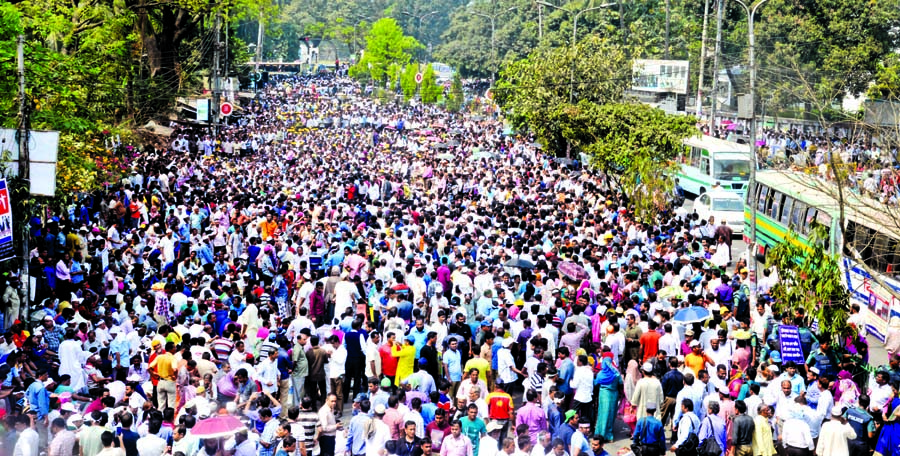 Pourasabha officers and staff continued their road blockade programme demanding nationalisation of their jobs and payment of arrears and salaries, creating obstacles to movement of vehicles and sufferings to commuters as well. This photo was taken from in