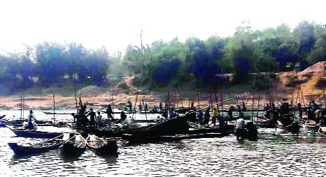 SYLHET: Illegal sand lifting is going rampantly from Jadhukata River in Sunamganj . This snap was taken on Wednesday.