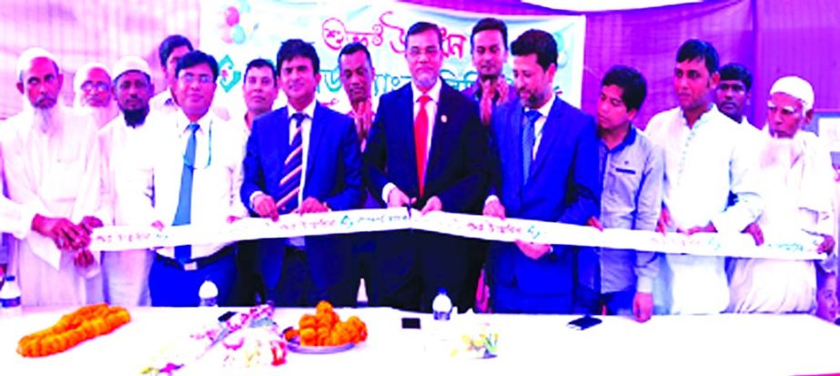 Md. Motaleb Hossain, DMD of Standard Bank Limited, inaugurating its 19th Agent Banking Outlet at Ramkrishnapur Bazar in Chander Char of Homna UZ in Comilla on Tuesday. Rezaur Rahman, Head of Agent Banking Division, Mirza Muhammad Masud Rana and senior off