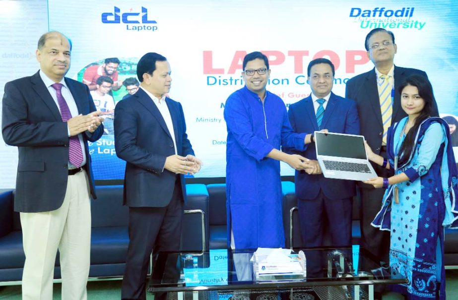 Zunaid Ahmed Palak, State Minister of ICT Division of Ministry of Posts, Telecommunication and ICT, distributing laptops among the students of Daffodil International University at the 71 Milonayoton of the University on Sunday.