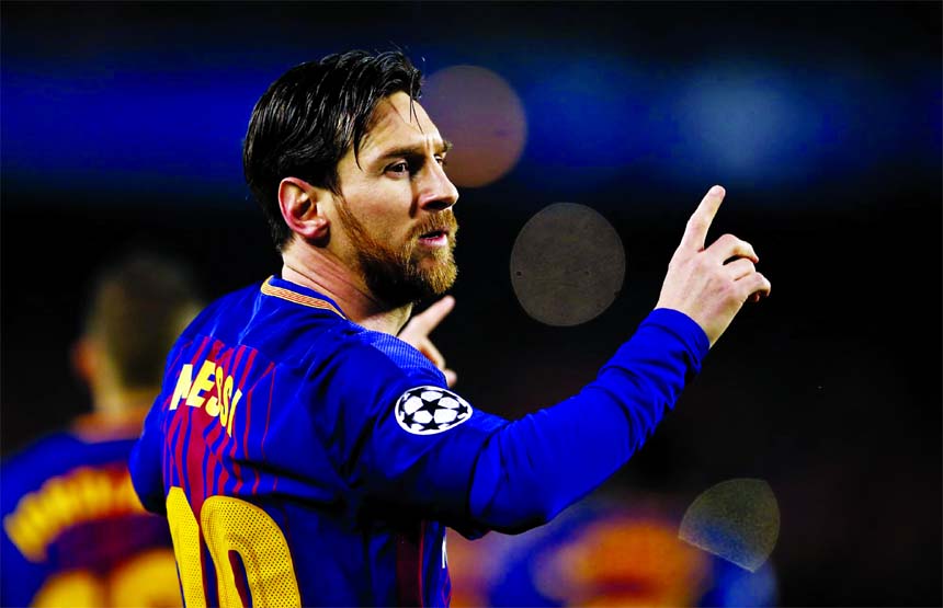 Barcelona's Lionel Messi celebrates after scoring the opening goal during the Champions League round of sixteen second leg soccer match between FC Barcelona and Chelsea at the Camp Nou stadium in Barcelona, Spain on Wednesday.