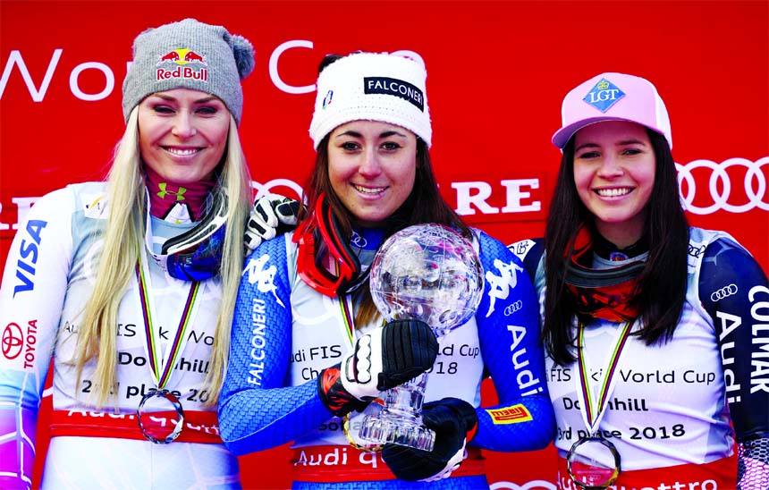 Italy's Sofia Goggia (center) winner of the women's World Cup downhill discipline title poses on the podium with second placed United States' Lindsey Vonn (left) and third placed Liechtenstein's Tina Weirather, at the alpine ski World Cup finals in Ar