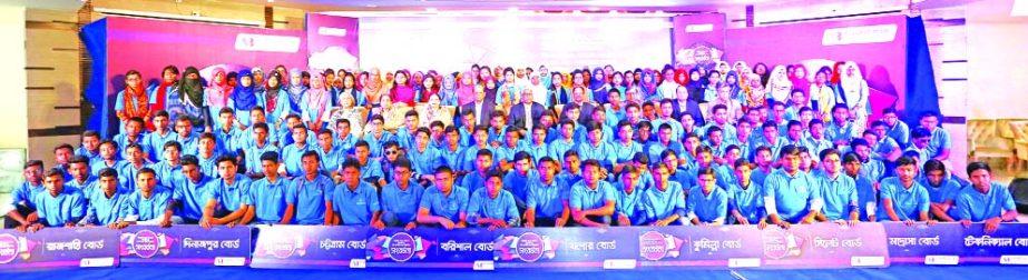 Alamgir Kabir, Chairman of Southeast Bank Limited, poses with the 200 scholarship winner students at a city club recently organized by Southeast Bank Foundation. M Kamal Hossain, Managing Director and Directors of the bank were also present.