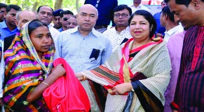 RANGPUR: Speaker of the Jatiya Sangsad Dr. Shirin Sharmin Chaudhury distributing blankets among poor and distressed women at a function held on the 'Dak Bungalow' premises in Pirganj town as Chief Guest on Thursday .