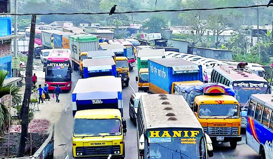Hundreds of vehicles got stuck in 15 km long tailback due to continuous eight-lane work of Dhaka-Comilla Highway. This photo was taken from Daudkandi-Gouripur area on Friday.