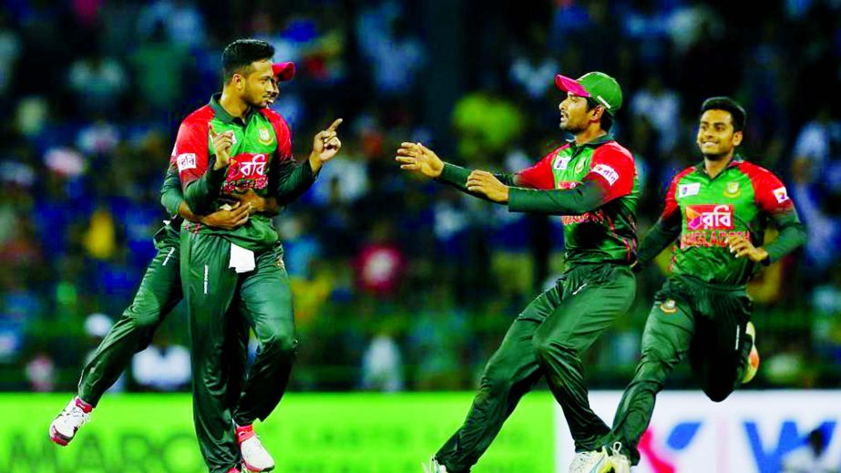 Shakib Al Hasan (left) celebrates the dismissal of Danushka Gunathilaka during their second Twenty20 cricket match in Nidahas Trophy in Colombo on Friday.