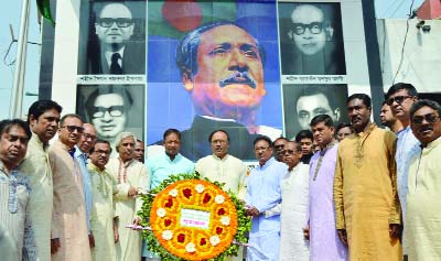 RAJSHAHI: Leaders of City Awami League placing wreaths at Shadhinota Chhattar on the occasion of the 98th birth anniversary of Bangabandhu and the National Children's Day yesterday.