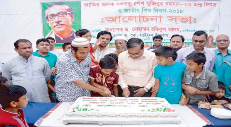 Prof Dr Rafiqul Alam, VC, Chittagong University of Engineering & Technology cutting cake on the occasion of 98th birth anniversary of Bangabandhu Sheikh Mujibur Rahman at CUET campus yesterday.