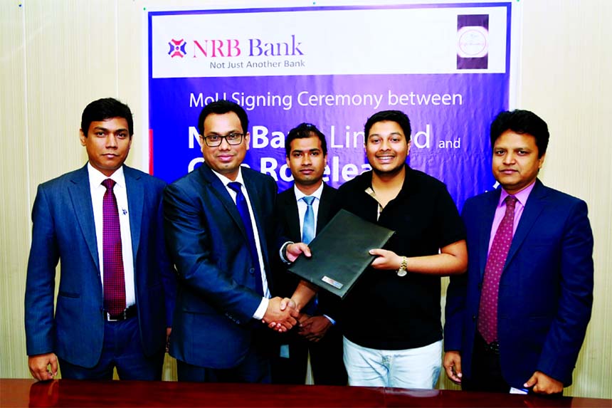 Imran Ahmed, Chief Operating Officer of NRB Bank Limited and Fayek Ahmed Shipu, Propitor of CafÃ© Roseleaf, Sylhet, exchanging an agreement signing documents at the banks head office in the city recently. Under the deal, Debit and Credit Cardholders of