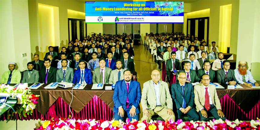 Syed Waseque Md. Ali, Managing Director of First Security Islami Bank Limited, poses with the participants of a Workshop on Anti-Money Laundering at Barisal on Friday. Jahangir Hossain, DGM of Bangladesh Bank, Md. Anwar Hossain, ED and Md. Mustafa Khair,