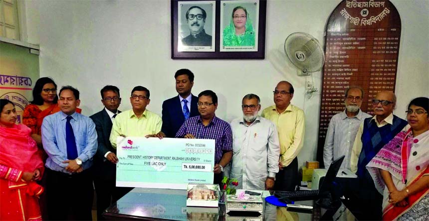 Kudrat-E-Khoda Md. Samiul Karim, Assistant Vice President of Midland Bank Limited, handing over a cheque of TK 5 lakh to Professor Dr. Mortuza Khaled, Chairman, History Department of Rajshahi University for renovation and modernization of the class room o