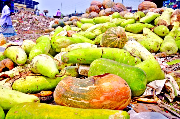 Small farm traders sufferings as half of the various kinds of fruits and vegetable being rotten under the open sky after harvesting due to lack of store house. This photo was taken from Shyambazar area on Sunday.