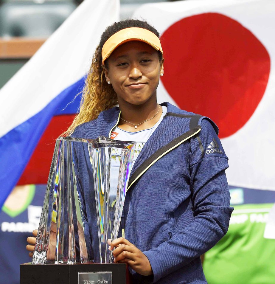 Naomi Osaka of Japan poses with her trophy after defeating Daria Kasatkina of Russia in the women's final at the BNP Paribas Open tennis tournament on Sunday in Indian Wells, Calif. Osaka won 6-3, 6-2.