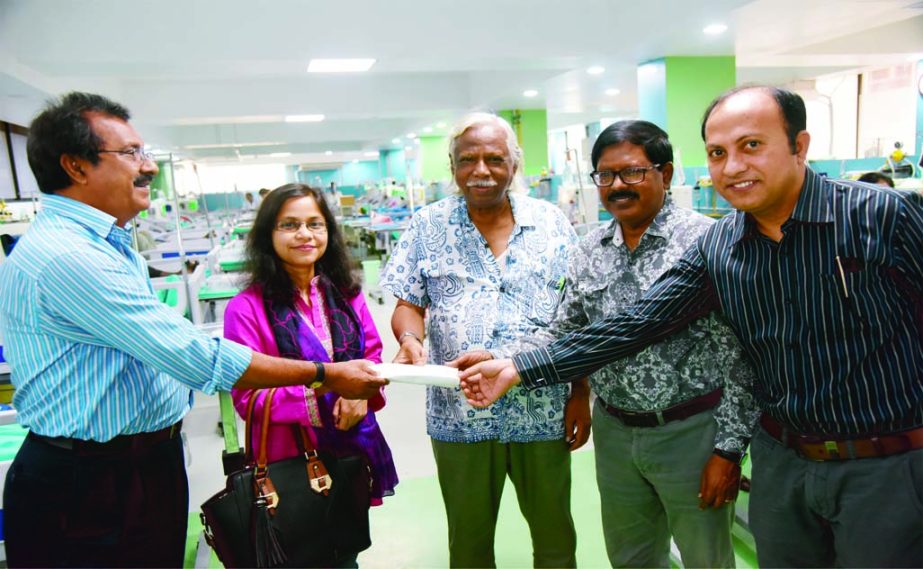 Serajul Islam Quadir, the Bureau Chief of Reuters, Bangladesh on behalf of Thomson Reuters, the largest global news network handed over a cheque of Tk one hundred and ten thousand to the founding president of Ganoswasthya Kendra Dr Zafrullah Chowdhury rec