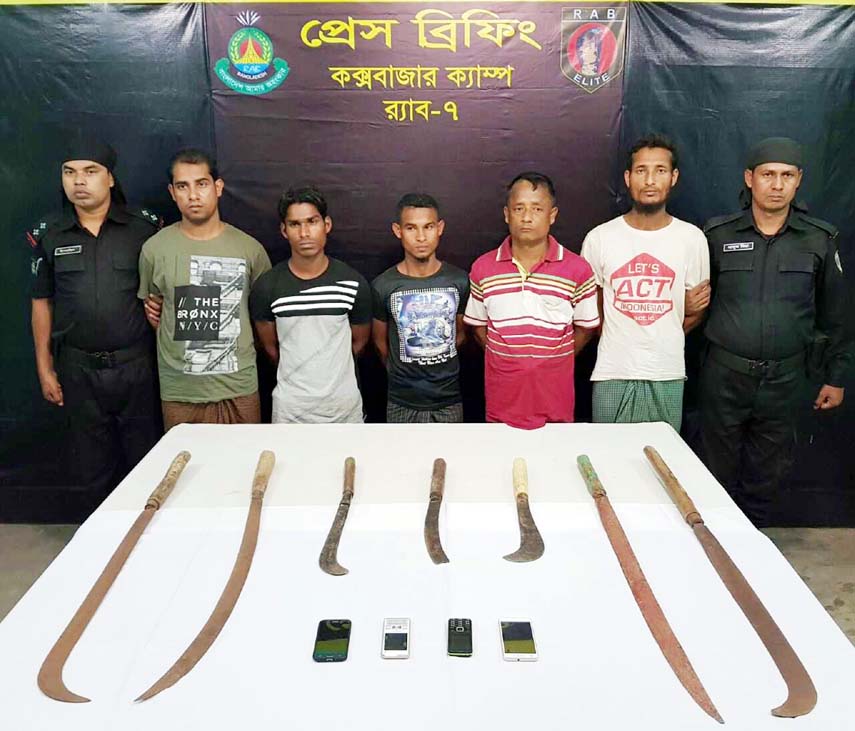 Members of Rapid Action Battalion (RAB) in a drive arrested five alleged 'Rohingya robbers' along with seven sharp weapons from Modhuchhara area in Ukhiya Upazila on Monday night.