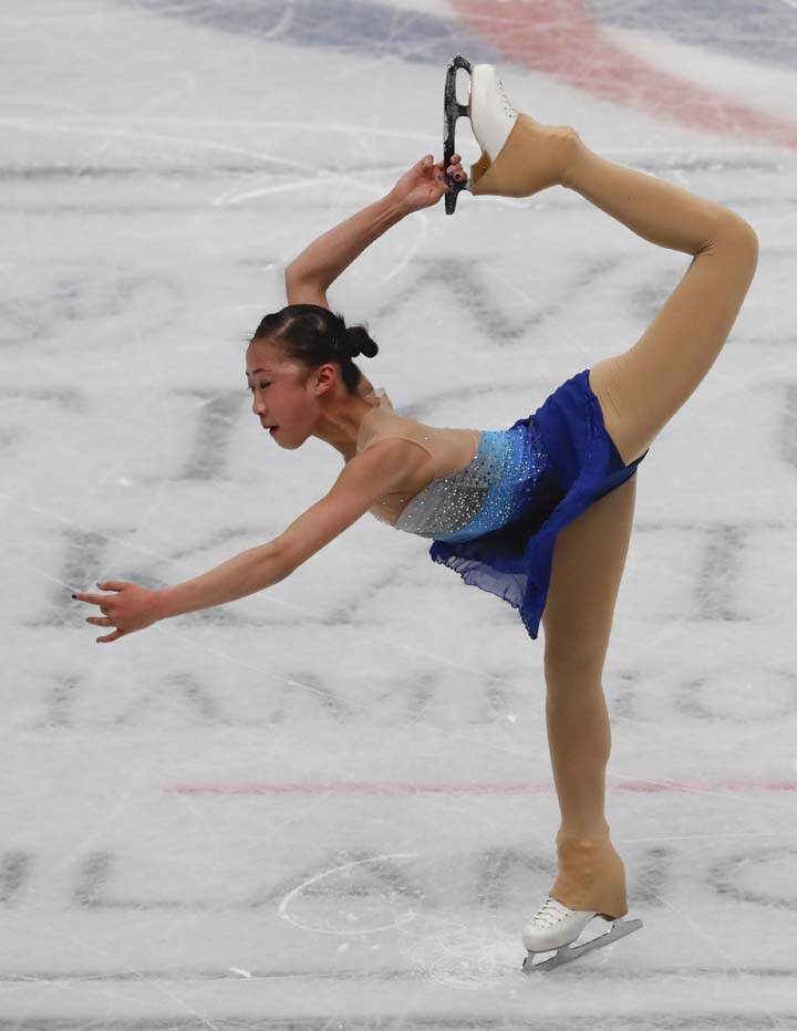 Xiangning Li of China performs during women's short program at the Figure Skating World Championships in Assago, near Milan on Wednesday.