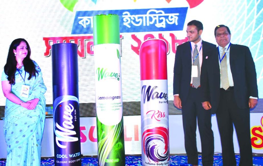 Tasvir-Ul-Islam, Managing Directors of Quasem Industries Limited, poses for a photograph of the launching programme of its new product Body Spy and Air-freshener at a city auditorium on Thursday. Sameed Quasem and Dr. Reyan Anis Islam, Directors of the co