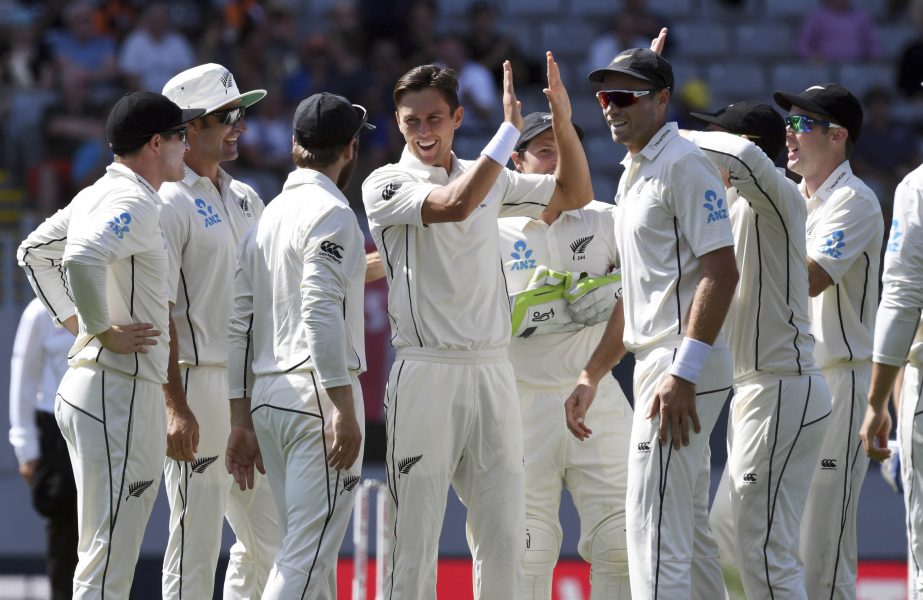 New Zealand's Trent Boult (center) celebrates the wicket of England's Ben Stokes during their first cricket Test in Auckland, New Zealand on Thursday.