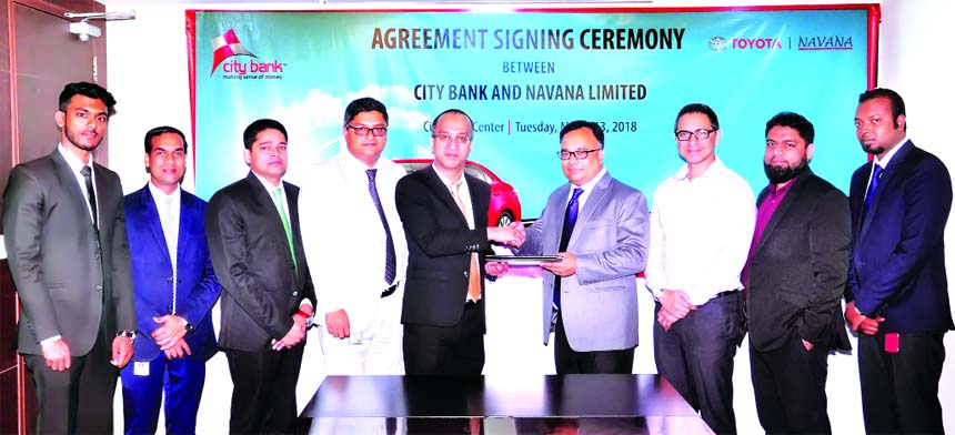 Mashrur Arefin, AMD of City Bank Limited and Md Shahid Muntasir, Head of Sales of Navana Limited, exchanging an agreement signing documents at the bank head office in the city recently. Under the deal, customers of the bank will avail auto loan at a speci