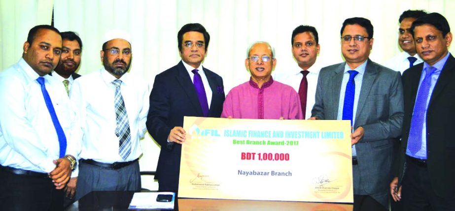 Abul Quasem Haider, Chairman, Board of Directors of Islamic Finance and Investment Limited (IFIL), handing over a cheque to Iqbal Hossain Akand, Nayabazar Branch Manager of the company as recognition of "Best Branch Award-2017" at its head office in the