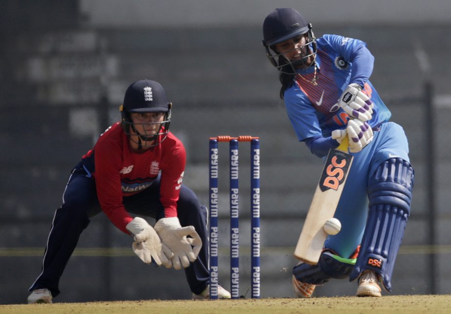 Indian Harmanpreet Kaur is bowled by England's Natasha Farrant during their match at the Women's T20 Triangular Series in Mumbai, India on Sunday.