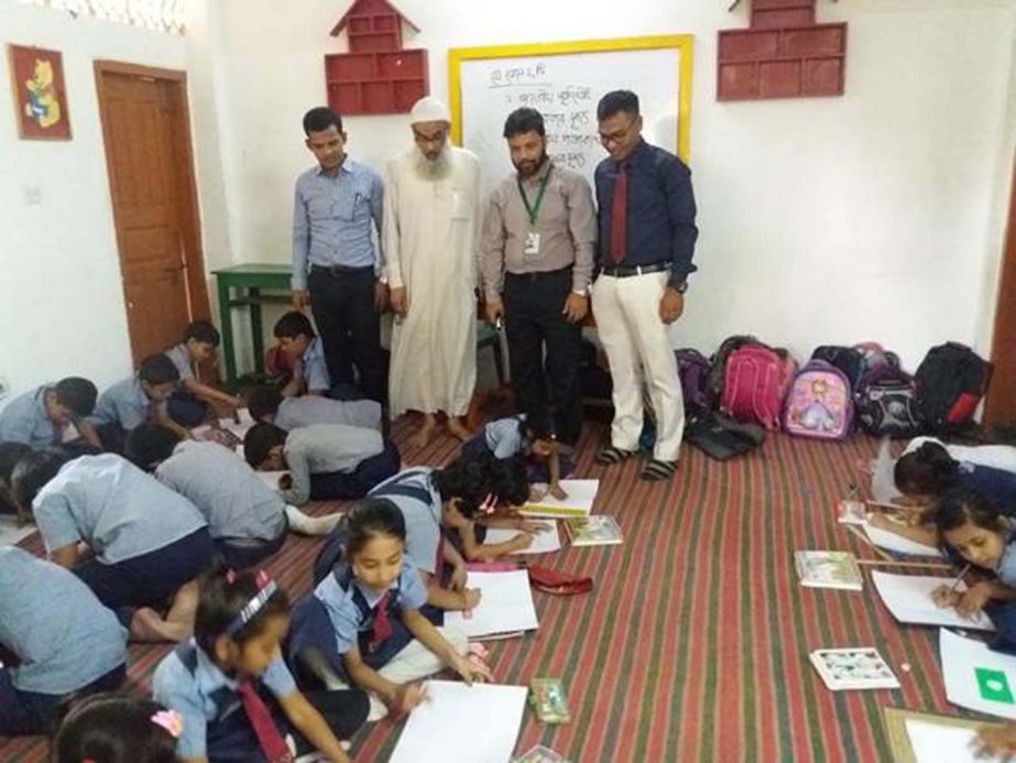 Chairman of Chittagong Education Welfare Foundation Principal Dr.Abdul Karim among others witnessing the drawing competition of the students at Parents Care School & College recently.