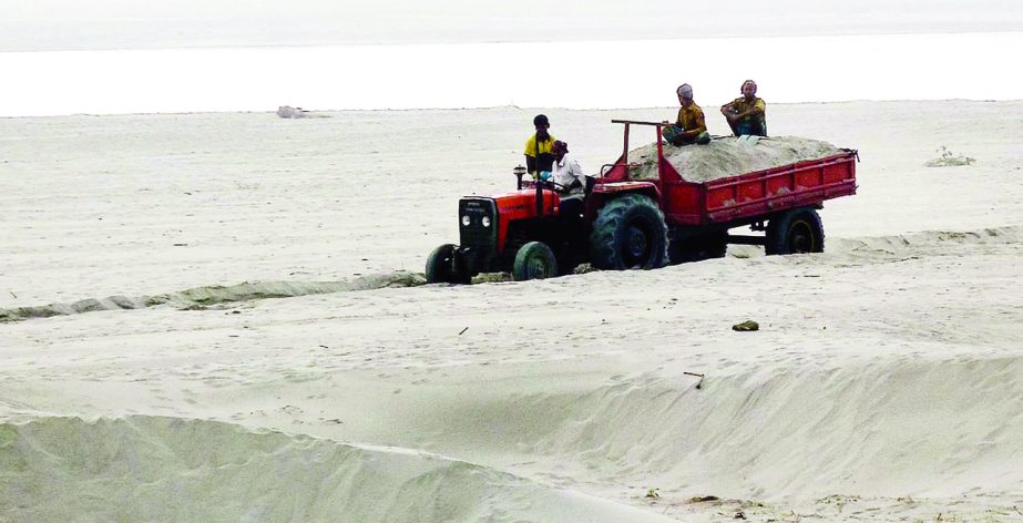 JAMALPUR: New char and Jamuna River Protection Dam have been threatened due to illegal sand lifting from Jamuna River at Islampur point. This snap was taken yesterday.