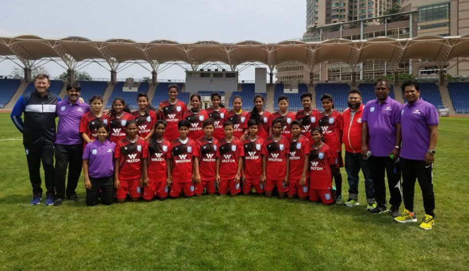 Members of Bangladesh National Under-15 Women's Football team pose for photo at Hong Kong on Thursday. Bangladesh play with Malaysia today.