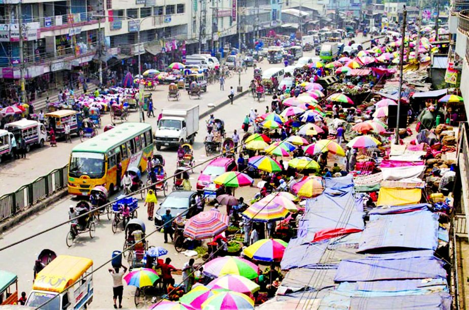 Make-shift shops occupied two thirds of the spaces on both sides of the busy road in Mirpur Sector-1, causing immense sufferings to commuters and permanent traders as well. This photo was taken on Thursday.