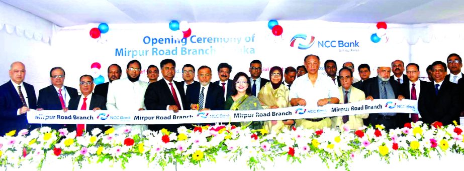Md. Nurun Newaz Salim, Chairman of NCC Bank Limited, inaugurating its 111th branch at Mirpur Road in the city on Thursday. Mosleh Uddin Ahmed Managing Director, Sohela Hossain, Vice-Chairman, Khairul Alam Chaklader, Abdus Salam and Amjadul Ferdous Chowdhu