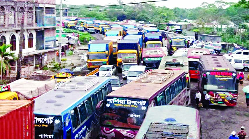 Hundreds of vehicles got stuck in a 42 Km tailback created on both sides of busy highway stretching from Madanpur to Daudkandi of Comilla due to heavy pressure of vehicles, causing untold sufferings to commuters.